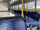 In the top section of a double-decker bus!