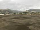 Standing on the sand dunes, we could see a lot of beach and fluffy grass in the distance!