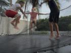 Me and my host brothers jumping on the trampoline. Who has the highest jump? 