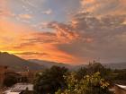 The view as the sunsets behind my house- we have the prettiest sunsets I have ever seen here!
