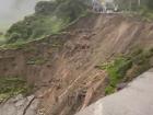 This is the same landslide; the road fell out and the people on one side are now separated from the other