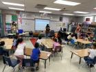 High School volunteers reading to my immersion class in Spanish