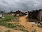 In the wet season, the sky is regularly grey and dark as shown here above the village taxi stand