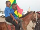Marjorie and Josephine riding on a horse on a recent field trip