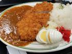 This katsu curry is served with hard-boiled egg and pickled vegetables (the red stuff in the corner)