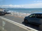On a train to Kamakura that runs along a stretch of road next to the ocean
