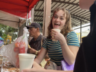 My friend Emily drinking atol de haba at a breakfast stand