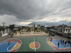 On the shores of lake Atitlán, men playing basketball to decompress