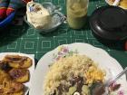 A classic Chapín (Guatemalan) dinner, featuring frijol (beans), arroz (rice), huevos revueltos (scrambled eggs), plátanos fritos (fried plantains) y crema (cream) y picante (spice)