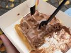 A Belgian flag sits on top of my chocolate waffle from Bruges!