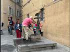 People refilling their water bottles with the fully functioning eagle-shaped fountain