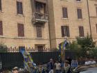 Siena’s neighborhood district residents (Contrada della Tartuca) wave their yellow and blue flag