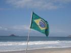 Brazil's flag blowing on the beach 