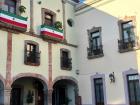 The center of Queretaro with Mexican flags on the balconies