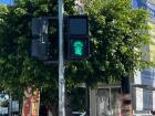 The street crossing signal has the typical doll that Querétaro is known for