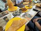 Crispy dosa (a type of rice pancake) dinner, with friends and their families