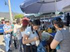 Buying coconut water in bag at a market in Huatulco