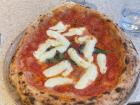 A whole margherita pizza (with tomato sauce, mozzarella, and basil)
