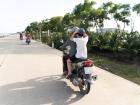 In Vietnam, many families ride motorbikes to school and around town