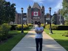 Me standing in front of the Legislative Assembly of Ontario