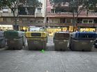 Color-coded street containers for common recyclables like plastics (yellow), glass (green), organic waste (brown) and paper/cardboards (blue)