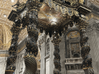 Bernini’s Baldacchino inside St. Peter’s Basilica — a massive bronze canopy marking the tomb of St. Peter