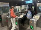 Before getting to the train, everybody has to tap their card on the stand to get through the gates