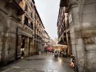 One of the beautiful arches in Plaza Mayor, a city square bordered by shops and restaurants
