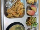 Lunch at one of the schools I teach at, featuring greens, fried rice, soup, apples and dessert!