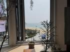 The beach in Busan from a 3rd floor brunch cafe window