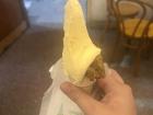 Ice cream in Argentina looks different from what we often see in the United States, instead of scooping perfect circles, workers shape the ice cream with a flat spatula and pack it into the cone, creating a soft mound on top