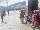 Women wearing traditional Andean clothing in the downtown center of Cusco