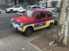 While on one of my afternoon walks, I stumbled upon this tiny car painted bright red, blue and yellow
