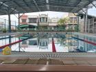 Students have swimming class at this outdoor pool