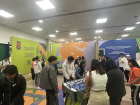 Participants play table football inside the 2026 World Cup volunteer tryout facilities, reflecting the spirited environment of the event