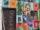 A mural in Amman titled "Society" in Arabic captures notable features of Jordanian history, nature and life
