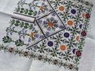 These are motifs designed by Shereen Quttaineh from a collection called "Forbidden Plants of Palestine," and embroidered by local artist, Amna Abdelhadi 