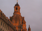 The sun setting on a church in Dresden, Germany