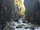 A view along the Partnach Gorge from a road carved into the side of the cliff