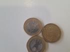 Two, one euro coins and a 50-cent coin -- notice the eagle on the back? That is Germany's minting symbol