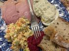Traditional Polish Christmas foods, including salads, bread and spreads commonly served during family gatherings