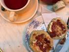 This is a proper scone with clotted cream and jam, served best with a warm cup of tea.