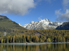 Štrbské pleso, a lake, with the snowy High Tatras in the background.