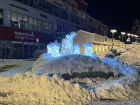 The Christmas decorations in my town (an angel with candles) under lots of snow!