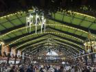 Inside the festival tent at Oktoberfest, musicians perform traditional songs that keep the celebration lively and fun.