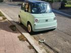 A tiny little car that a student drives to school!