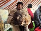 Mongolian Eagle Hunters are a great source of national pride, and this hunter is wearing a coat made from multiple wolf pelts