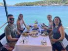 Enjoying lunch by the sea -- check out that blue water!