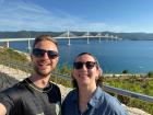 Flora and her friend John with the new Pelješac bridge in the background