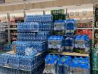The price of water at the grocery store is given in euros